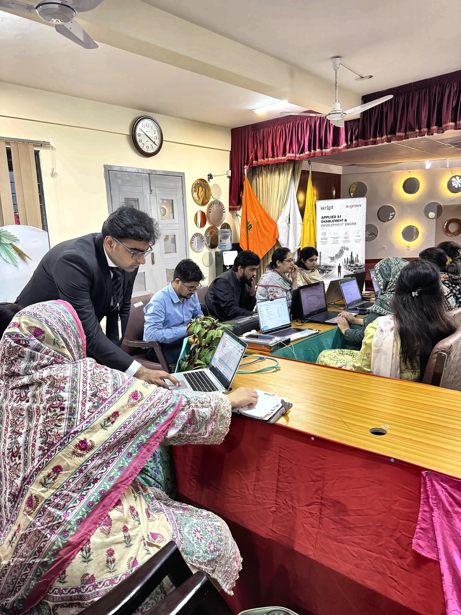 skr1pt trainer guiding a teacher through an AI tool on her laptop